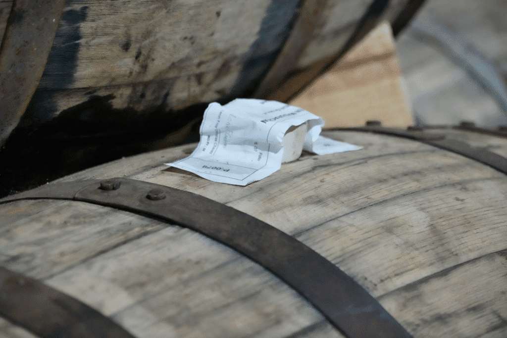 Wooden aging barrels with a tag, showcasing a VIP Winery Vacations experience.