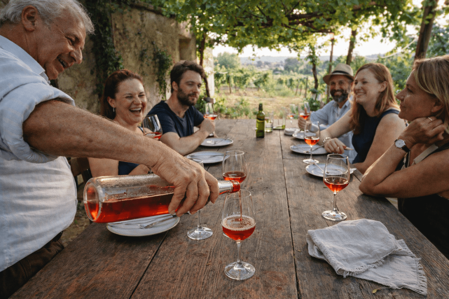Intimate wine tasting at a family estate in Puglia, guests seated with the winemaker during a private Apulia wine tour with local food